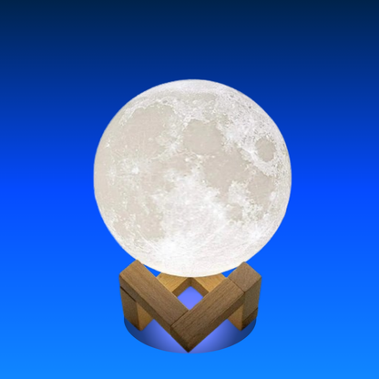 Moon-shaped lamp on a wooden stand against a blue background