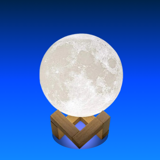 Moon-shaped lamp on a wooden stand against a blue background