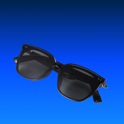 Black sunglasses on a blue background