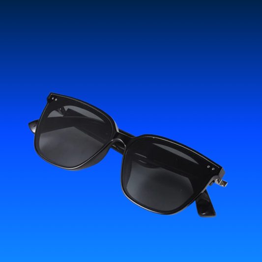 Black sunglasses on a blue background
